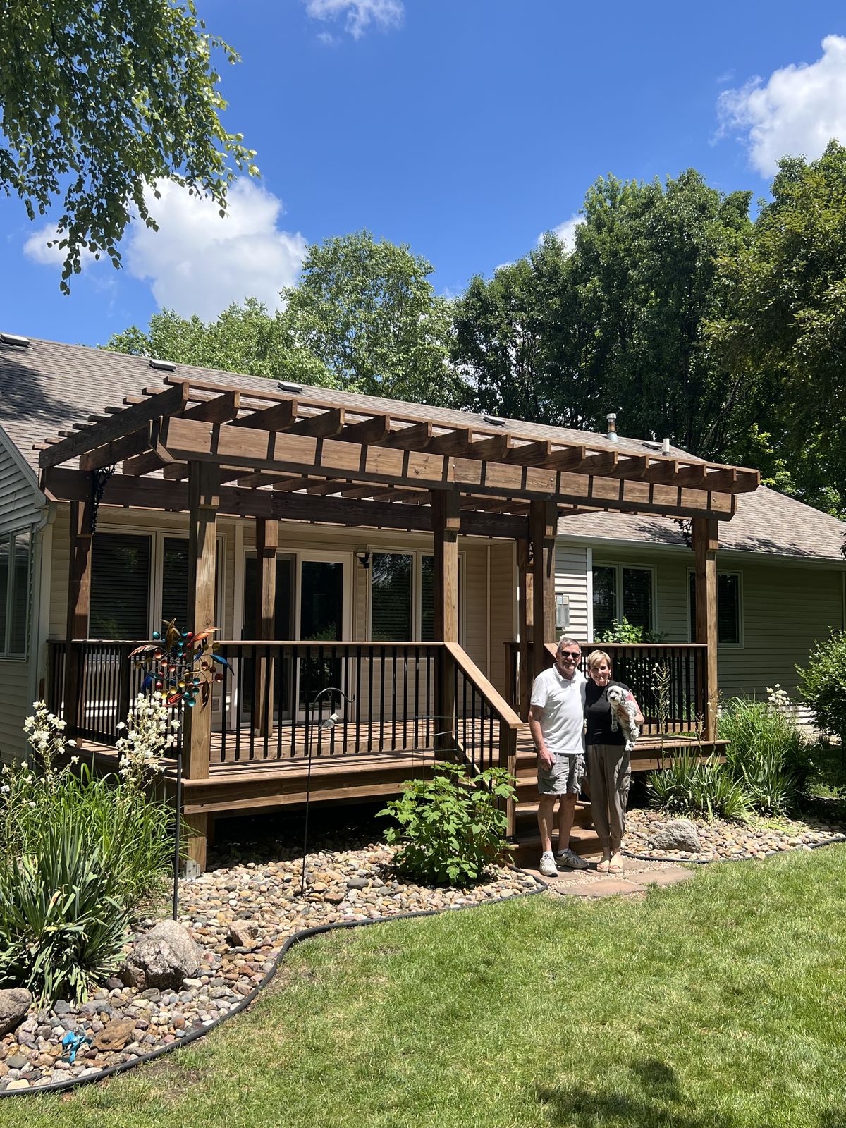 Pergola deck with railing and steps