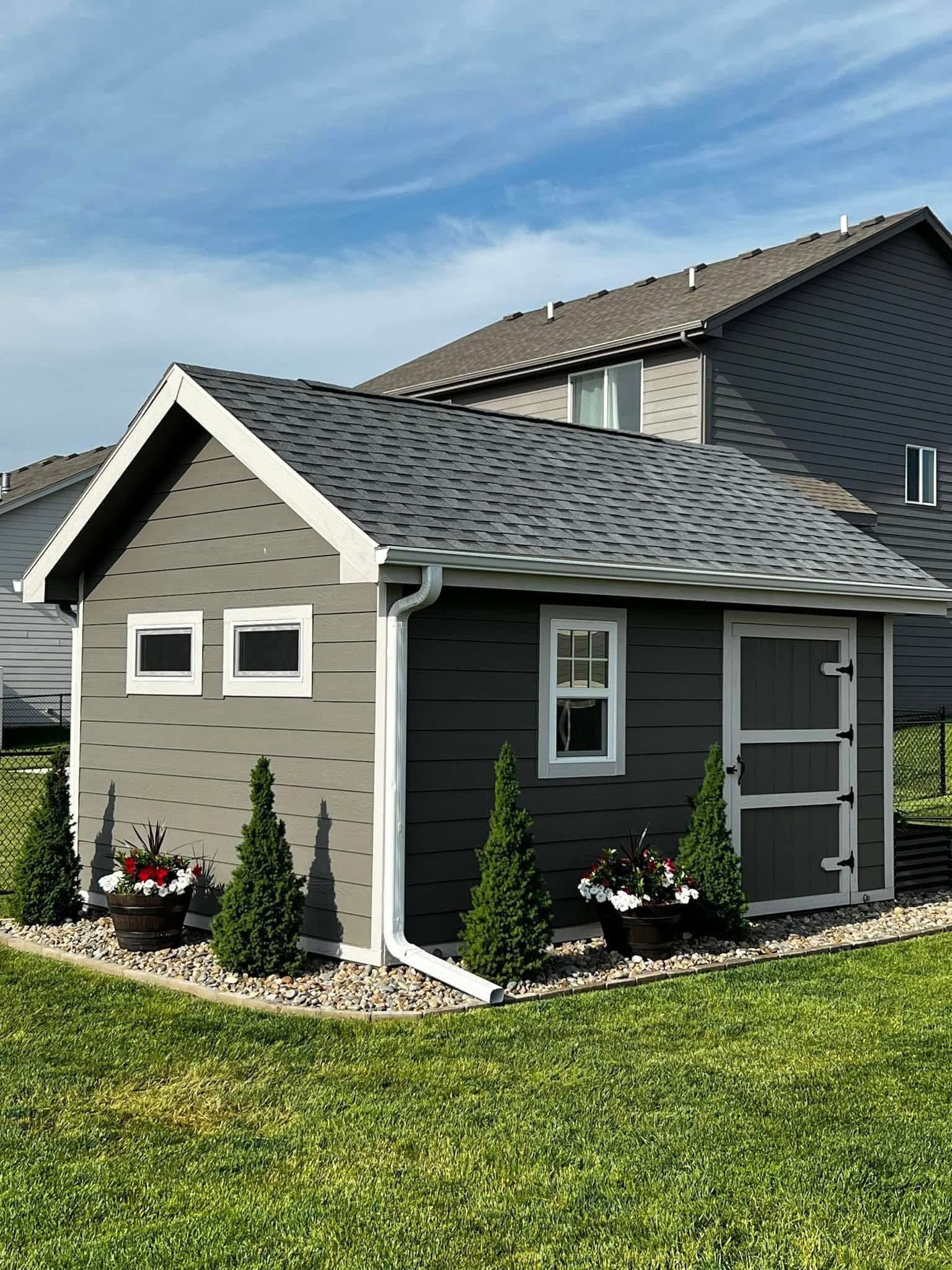 Charcoal shed with white trim