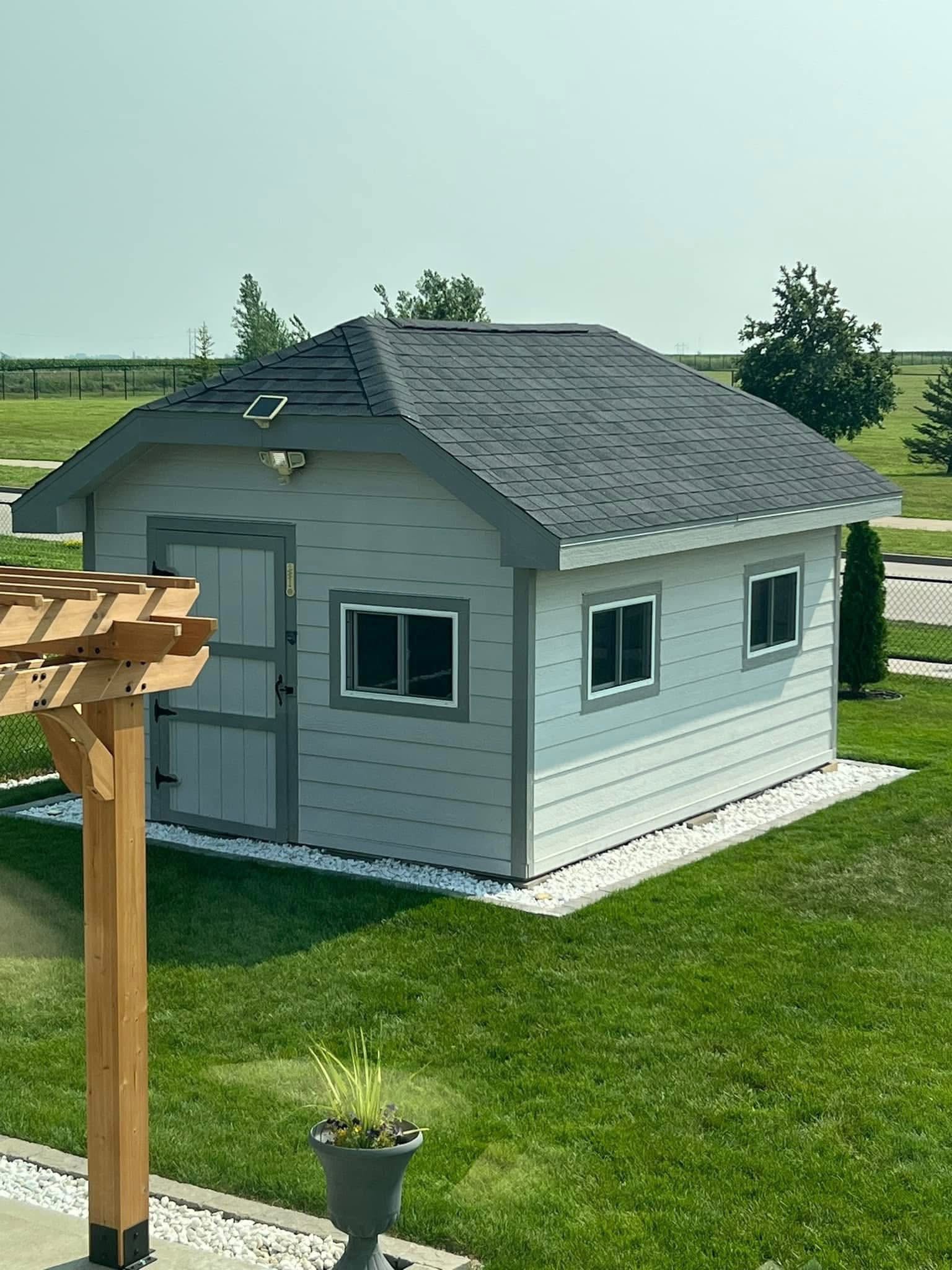 Light blue hip-roof shed